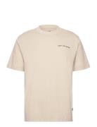 Reimagined Graphic T-Shirt 2 Sport Men Sports Clothes Sport Tops Sport T-Skjorte Beige New Balance